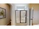 Modern bathroom with a glass-enclosed shower and sleek fixtures, enhanced by a bright, neutral color scheme at 75 E American Marigold Dr # 37, Benson, NC 27504