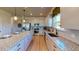 Modern kitchen with stainless steel appliances, granite countertops, and ample cabinet space, perfect for cooking at 75 E American Marigold Dr # 37, Benson, NC 27504