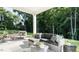 Relaxing patio with comfortable seating, stylish decor, and a beautiful green backyard at 75 E American Marigold Dr # 37, Benson, NC 27504