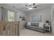 Bright bedroom with a cozy sofa, perfect for relaxing and reading at 7517 Chippenham Ct, Raleigh, NC 27613