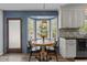 Charming breakfast nook with bay window, perfect for enjoying morning light at 7517 Chippenham Ct, Raleigh, NC 27613