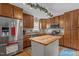 This inviting kitchen features stainless steel appliances, wood cabinets and butcher block island countertop at 7621 Troy Stone Dr, Fuquay Varina, NC 27526