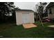 Backyard features a storage shed, play set, and green grass at 780 Pondview Ct, Rocky Mount, NC 27804