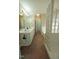 Bathroom with double sinks, granite tile floors, and a shower featuring glass block at 780 Pondview Ct, Rocky Mount, NC 27804