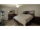 Bright primary bedroom features a ceiling fan, TV, dresser, and an exercise bike at 780 Pondview Ct, Rocky Mount, NC 27804