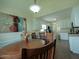 Open dining area with chairs, table and modern art in a brightly lit space at 780 Pondview Ct, Rocky Mount, NC 27804