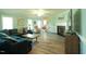 Spacious living room with a cozy fireplace, large windows, and stylish decor at 780 Pondview Ct, Rocky Mount, NC 27804