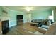 Bright living room features elegant fireplace, comfortable seating, and modern entertainment setup at 780 Pondview Ct, Rocky Mount, NC 27804