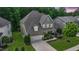 A beautiful two-story home showcasing a manicured lawn, stone accents, and an attached two-car garage at 82 Idlewood Ln, Clayton, NC 27527