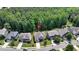 Aerial view of homes in a tree-lined neighborhood with well-maintained yards at 82 Idlewood Ln, Clayton, NC 27527