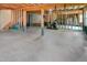 Unfinished basement with concrete floor, exposed wooden beams, and support pillars at 82 Idlewood Ln, Clayton, NC 27527
