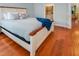 Comfortable bedroom with wood flooring and a stylish bed and closet at 82 Idlewood Ln, Clayton, NC 27527