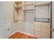 Walk-in closet with built-in shelves and drawers for optimal organization and storage at 82 Idlewood Ln, Clayton, NC 27527