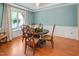 Charming dining room with classic table and chairs, complemented by large window and decorative floral centerpiece at 82 Idlewood Ln, Clayton, NC 27527