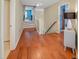 Inviting entryway with hardwood floors and a glimpse of the brightly painted room ahead at 82 Idlewood Ln, Clayton, NC 27527