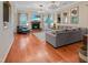 Open-concept living room with hardwood floors, a fireplace, and plenty of natural light at 82 Idlewood Ln, Clayton, NC 27527