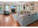 Cozy living room with hardwood floors, gray sectional, and gas fireplace at 82 Idlewood Ln, Clayton, NC 27527