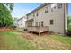 Large backyard featuring a deck and mature trees, with privacy at 821 Laurel Garden Way, Cary, NC 27513