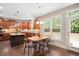 Charming dining area with natural light, stylish furniture, and seamless access to the kitchen at 821 Laurel Garden Way, Cary, NC 27513