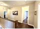 Upstairs hallway with hardwood floors and neutral wall color at 821 Laurel Garden Way, Cary, NC 27513