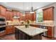 Beautiful kitchen features a large island, stainless steel appliances, granite counters and custom cabinets at 821 Laurel Garden Way, Cary, NC 27513