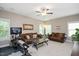 Cozy living room with a TV, comfortable sofas, and exercise equipment at 821 Laurel Garden Way, Cary, NC 27513