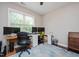Bright, sunny office with large windows, dual monitors, and comfortable office chairs at 821 Laurel Garden Way, Cary, NC 27513