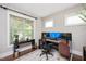 Bright home office with dual monitors, desk, and a large window at 821 Laurel Garden Way, Cary, NC 27513