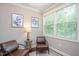 Comfortable sitting area with plush chairs and a window view at 821 Laurel Garden Way, Cary, NC 27513