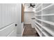 Walk-in closet featuring ample shelving, drawers, and hanging storage solutions for organizing clothing and accessories at 901 Del Webb Manor Ave, Wake Forest, NC 27587