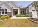 Inviting home facade with well-maintained lawn, stone details, and a cozy front porch setting at 901 Del Webb Manor Ave, Wake Forest, NC 27587