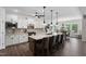 Modern kitchen with large island, granite countertops, pendant lighting, and stainless appliances at 901 Del Webb Manor Ave, Wake Forest, NC 27587