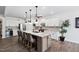 Stylish kitchen with granite island, ample cabinet space, and modern finishes at 901 Del Webb Manor Ave, Wake Forest, NC 27587