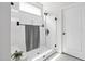 Clean and modern glass-enclosed shower with white tile, and contemporary fixtures at 901 Del Webb Manor Ave, Wake Forest, NC 27587