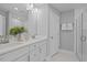 Elegant primary bathroom with double vanity, white cabinets, and glass-enclosed shower at 910 Kensley Grove Ln # 70, Fuquay Varina, NC 27526
