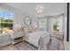Bedroom boasts hardwood floors, lots of windows, and stylish decor at 910 Kensley Grove Ln # 70, Fuquay Varina, NC 27526