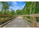 Wooden bridge and walkway meander through the community's lush, natural landscape at 910 Kensley Grove Ln # 70, Fuquay Varina, NC 27526