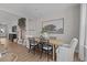 Bright eat-in dining area with a natural wood table with a view to the staircase at 910 Kensley Grove Ln # 70, Fuquay Varina, NC 27526