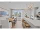 Eat-in kitchen with long island featuring bar stool seating and stylish light fixtures at 910 Kensley Grove Ln # 70, Fuquay Varina, NC 27526