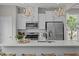 Bright kitchen features a large island with stainless steel appliances and stylish pendant lighting at 910 Kensley Grove Ln # 70, Fuquay Varina, NC 27526