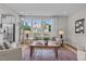 Inviting living room with large windows, neutral tones, and comfortable seating arrangement at 910 Kensley Grove Ln # 70, Fuquay Varina, NC 27526