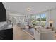 Open-concept living space with natural light featuring a kitchen and living room combination at 910 Kensley Grove Ln # 70, Fuquay Varina, NC 27526