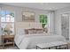 Spacious primary bedroom boasts carpet, lots of windows, ceiling fan, and stylish decor at 910 Kensley Grove Ln # 70, Fuquay Varina, NC 27526