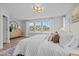 Spacious primary bedroom boasts carpet, lots of windows, ceiling fan, and stylish decor at 910 Kensley Grove Ln # 70, Fuquay Varina, NC 27526