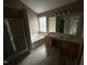 Bathroom with double sinks, tub, and shower at 10 Gwendolyn Cir, Durham, NC 27703