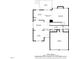 Detailed first floor plan showing kitchen, living room, dining room, and garage dimensions at 10 Gwendolyn Cir, Durham, NC 27703