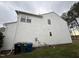 A white siding wall is seen on the side of this home with necessary utilities neatly arranged at 10 Gwendolyn Cir, Durham, NC 27703