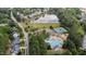 Aerial view of community featuring a lake, pool, tennis courts, playground, and surrounding neighborhood at 1004 Taywood Way, Apex, NC 27502