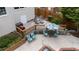 Outdoor patio area featuring stylish seating, a grill, and a well-maintained fenced yard at 1004 Taywood Way, Apex, NC 27502
