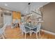 Cozy eat-in kitchen with wooden floors and a large dining table adjacent to the kitchen island at 1004 Taywood Way, Apex, NC 27502